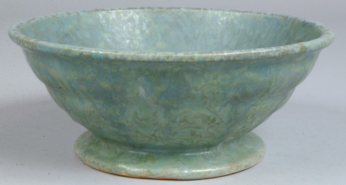 Roseville Footed Bowl, Carnelian II in blue-green : Roseville Footed Bowl, Carnelian II in blue-green with horizontal ripple shaped exterior, marked: "Roseville Pottery" on bottom as a gray and black sticker. 9 3/4"dia. Condition: Good