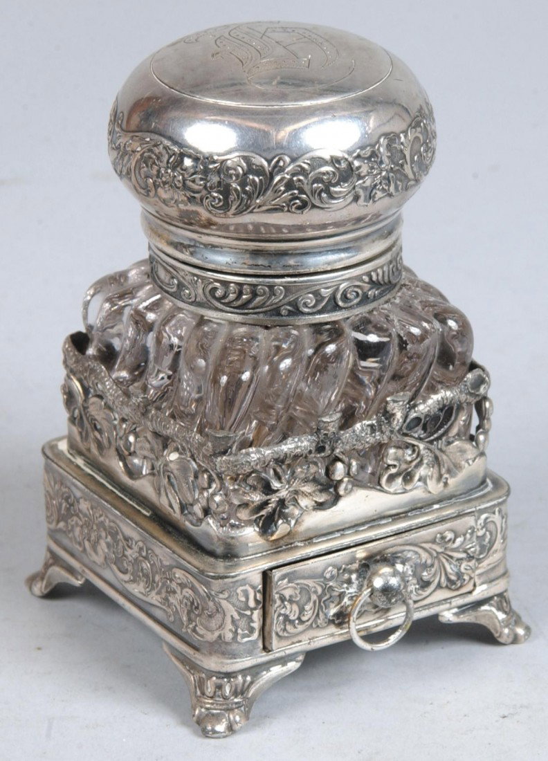 Pressed Glass Ink Bottle on Silver Plated Stand wi: Pressed Glass Ink Bottle on Silver Plated Stand with Drawer, bulbous hinged cap, independent plated stand marked: "Pairpoint Mfg. Co., Pat. Aug. 22, '98, Quadruple Plate". 4 1/2"h. Condition: