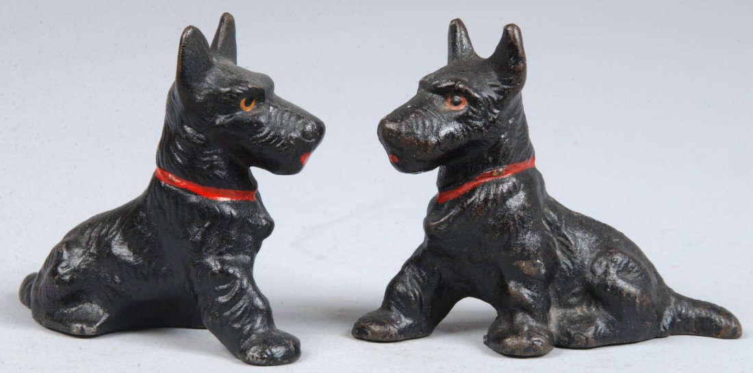 Two Black Painted Cast Iron Scottie Dogs, as patte: Two Black Painted Cast Iron Scottie Dogs, as pattern No. 391 Hubley. Unmarked. 2 3/4"h. X 3 1/4"h. Condition: Good