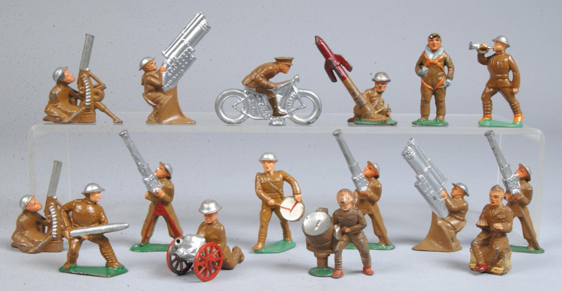 Sixteen Assorted Manoil Painted Cast Lead Military: Sixteen Assorted Manoil Painted Cast Lead Military Figures, three tripod gunners, two seated gunners, rocket launcher, two vertical machine gunners, shell loader, typist, flyer, drummer, motorcyclist,