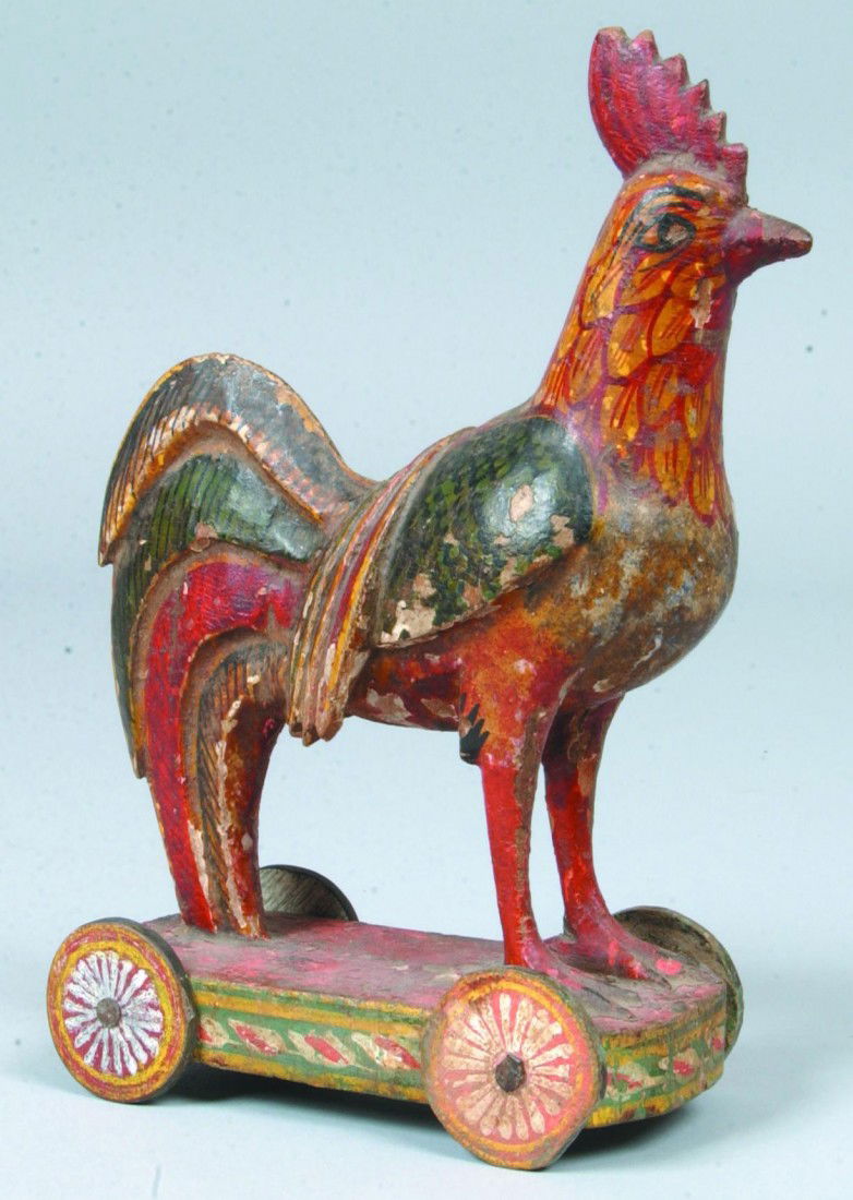 Carved and Painted Rooster Pull Toy, gesso wood wi: Carved and Painted Rooster Pull Toy, gesso wood with polychrome decoration, four wheeled base, Continental; 5"l. x 8"h.; Condition: paint loss, two wheels replaced.