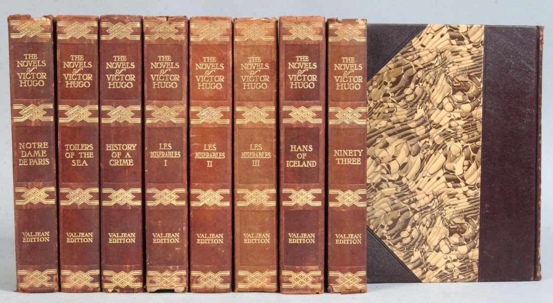 Nine Quarter Bound Leather Volumes of "The Novels : Nine Quarter Bound Leather Volumes of "The Novels of Victor Hugo, Val jean Edition", NY/London, no date. Brown marbled covers and end papers, 9 1/4"h. X 6 3/4"d. X 13"w. total. Condition: some use wea