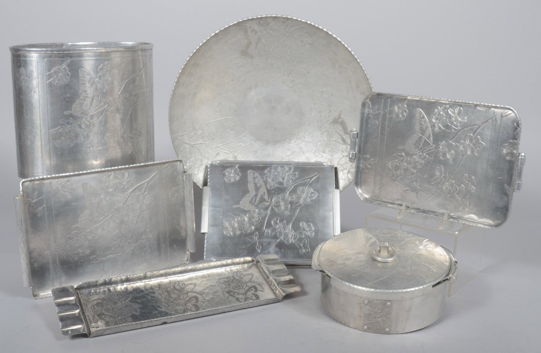 Seven Pieces of Aluminum with Embossed Dogwood and: Seven Pieces of Aluminum with Embossed Dogwood and Butterfly Pattern by Arthur Armour. Waste basket, 10"h, center bowl, 17 1/4" diam., covered casserole with glass liner (chips), two various rectangul