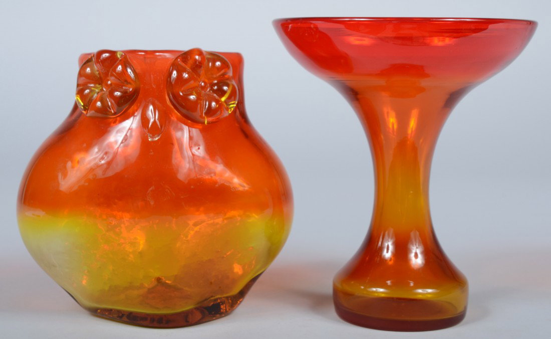 Two Blenko Tangerine Vases, owl shaped with applie: Two Blenko Tangerine Vases, owl shaped with applied eyes and beak, sandblasted mark, 7"h.; and a pedistal saucer shape with hollow stem and base, sandblasted mark, 7 3/4"h.; both Good.