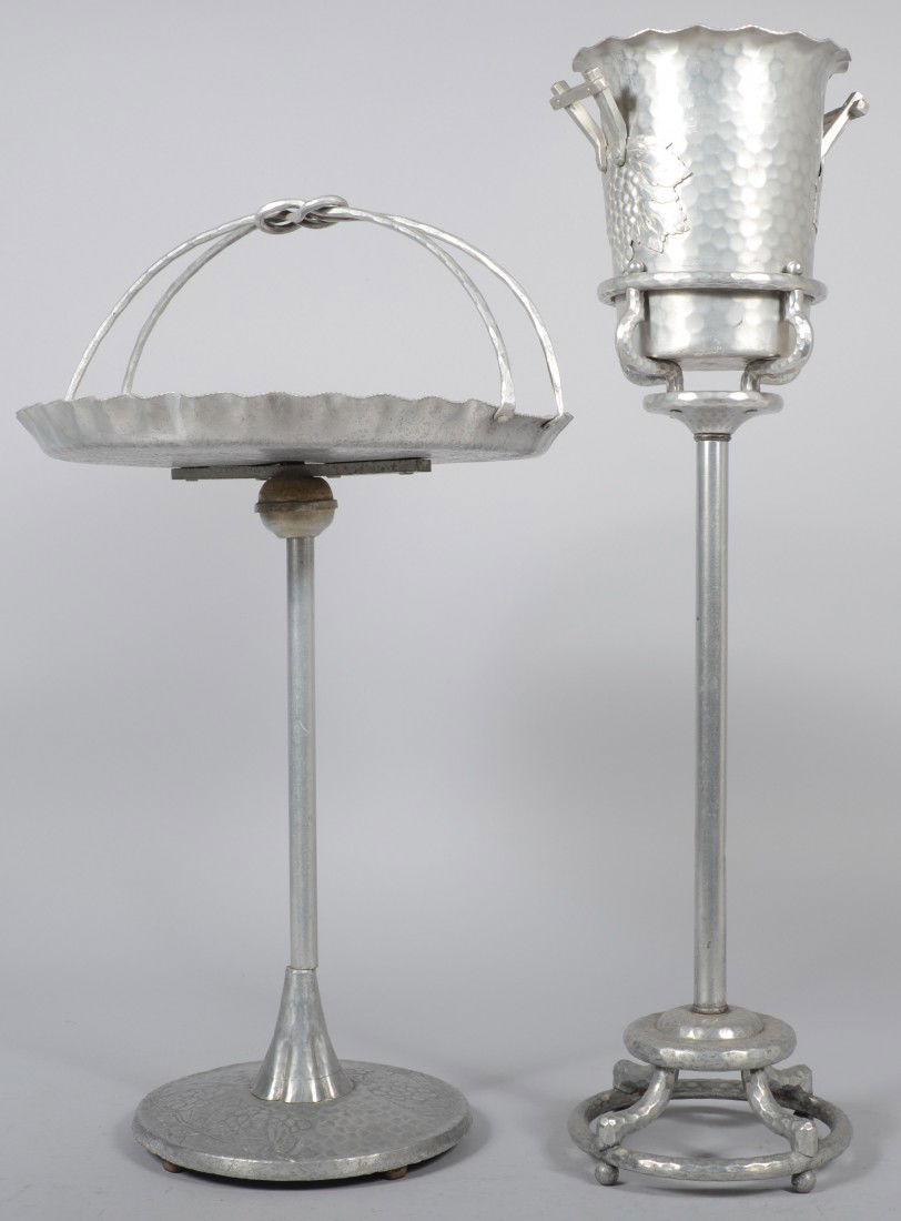 Two Pieces of Grape Pattern Aluminum; wine cooler: Two Pieces of Grape Pattern Aluminum; wine cooler and stand (marked Everlast), 34" high and a pedestal base serving stand (unsigned), 30" high. Condition: good with minor corrosion.