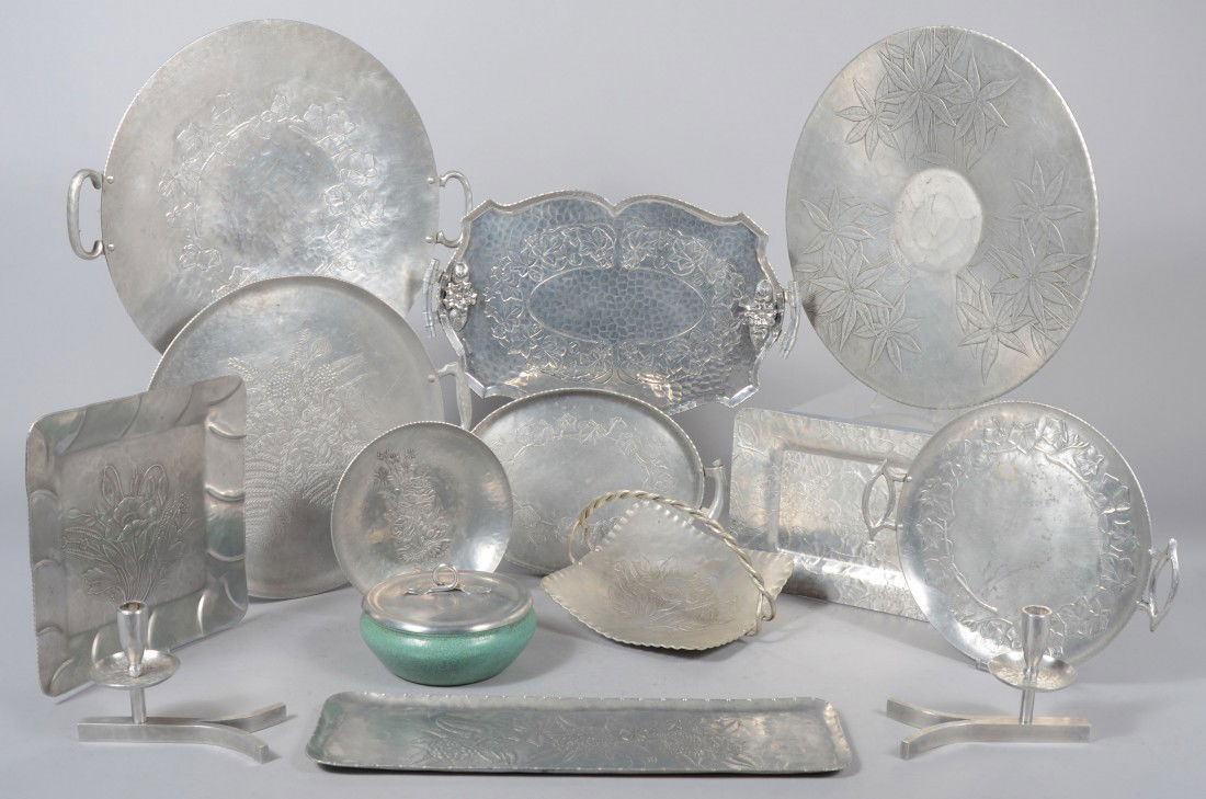 12 Pieces of Floral Pattern Aluminum by various ma: 12 Pieces of Floral Pattern Aluminum by various makers. Pair Wendell August sprig design candle holders with "Y" shaped bases, 7 3/4" long and dogwood rectangular tray, 13 3/4" wide, Arthur Armour Poi