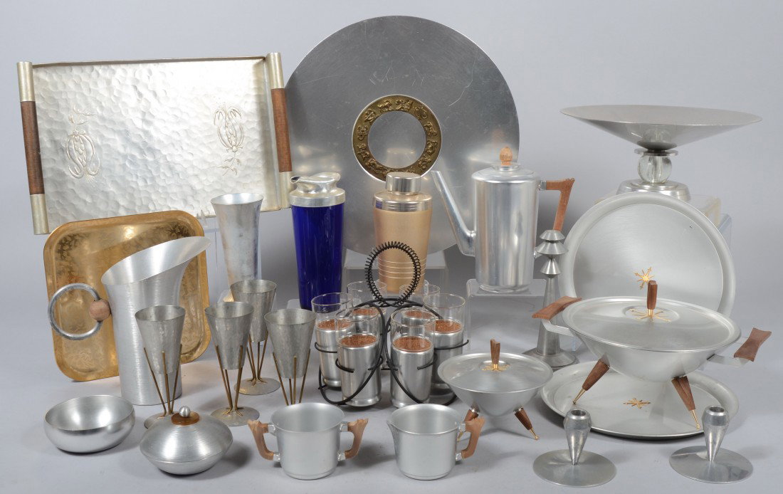 Lot of Mid-Century Spun Aluminum Items including R: Lot of Mid-Century Spun Aluminum Items including Russel Wright 10" water pitcher (Crack on wood ball handle attachment), Kensington three piece coffee set, center bowl with lucite ball standard, zodia