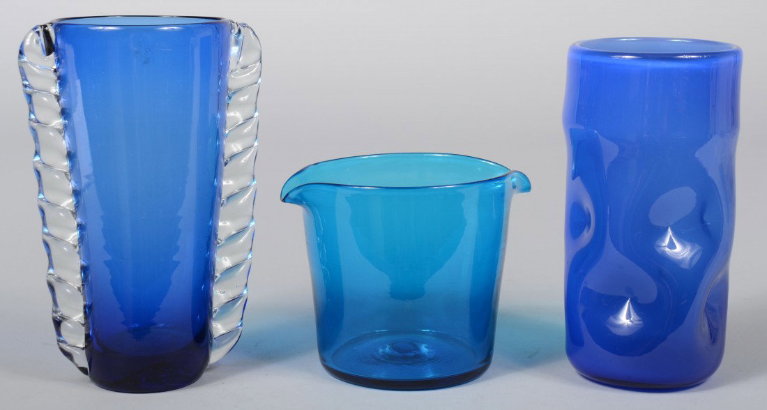 Three Blenko Blue Vases, small bucket shape with d: Three Blenko Blue Vases, small bucket shape with double pulled rim, 4 1/4"h.; conical shape with crimped crystal wings, 7 1/2"h.; white cased blue, dimple sided cylinder, 7"h.; all unmarked; all Good.