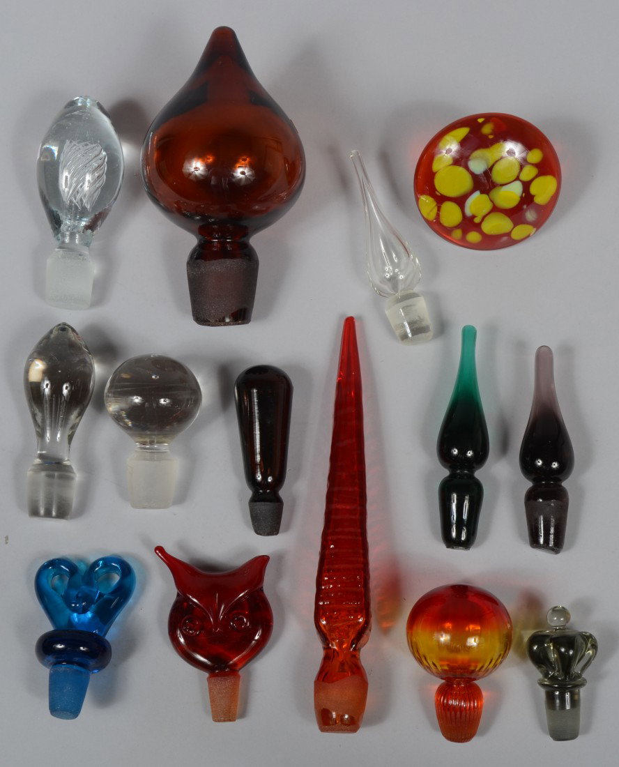 Fourteen Blenko Stoppers, miscellanious group incl: Fourteen Blenko Stoppers, miscellanious group including an air twist, crystal and various colors, a mushroom type, stamped and tooled types, several sizes, all Good.