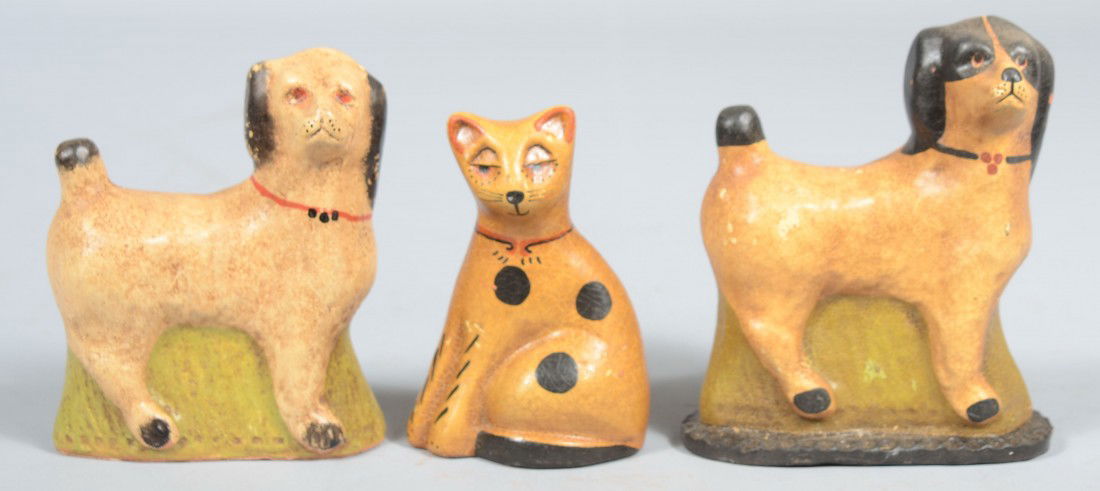 Three Pieces Contemporary Cast Redware Animals. Tw: Three Pieces Contemporary Cast Redware Animals. Two standing Dogs and a seated Cat. These are painted and aged. Dog: 5"h.; Cat: 4 1/4"h.; Dog marked: "Springfield Pottery, '86", 4 3/4"h. All pieces fr