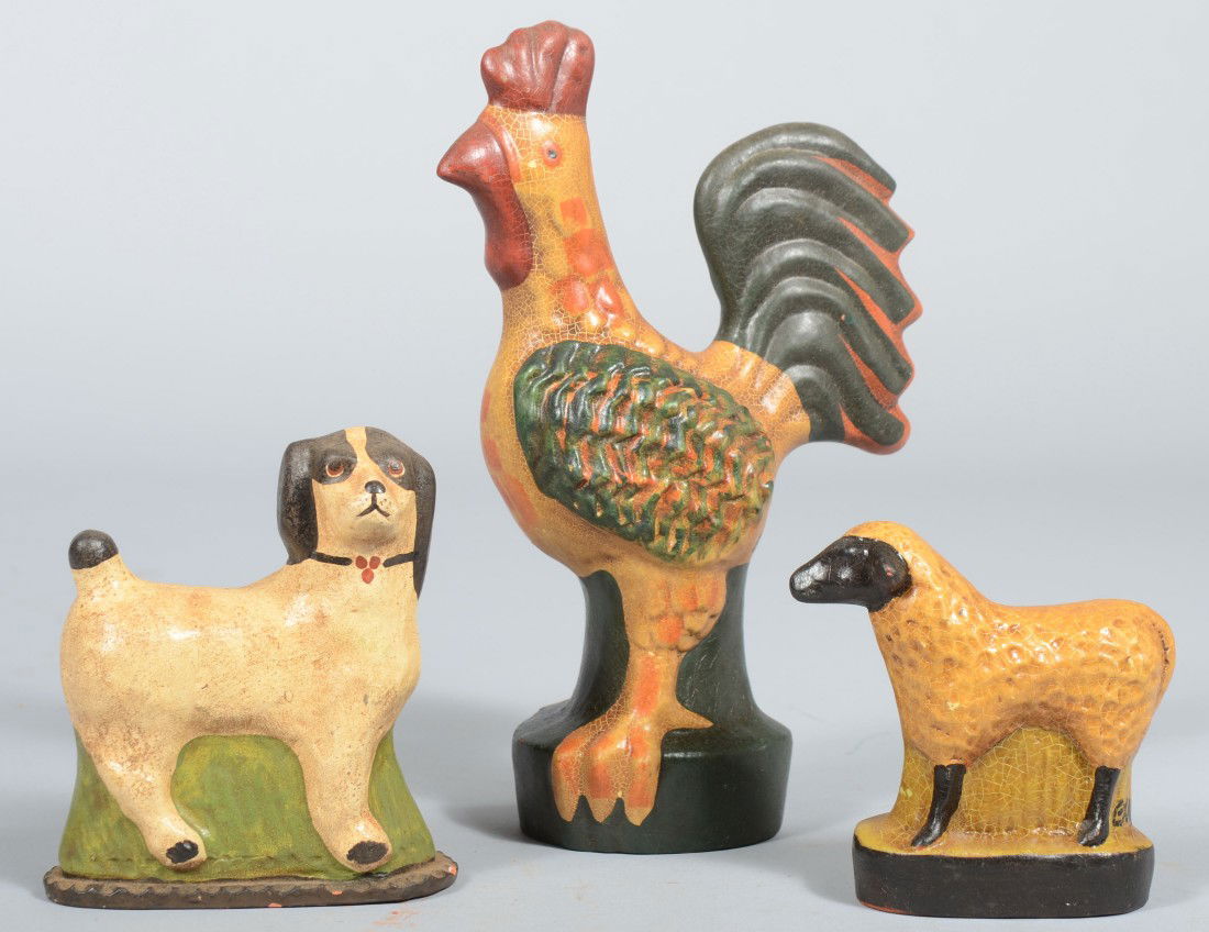 Three Pieces Contemporary Cast Redware Animals. A: Three Pieces Contemporary Cast Redware Animals. A standing rooster, a standing dog, and a standing lamb. All bear a seated stag mark (unknown) on their bottoms. Rooster: 9 1/4"h.; Dog: 5"h. and Lamb:
