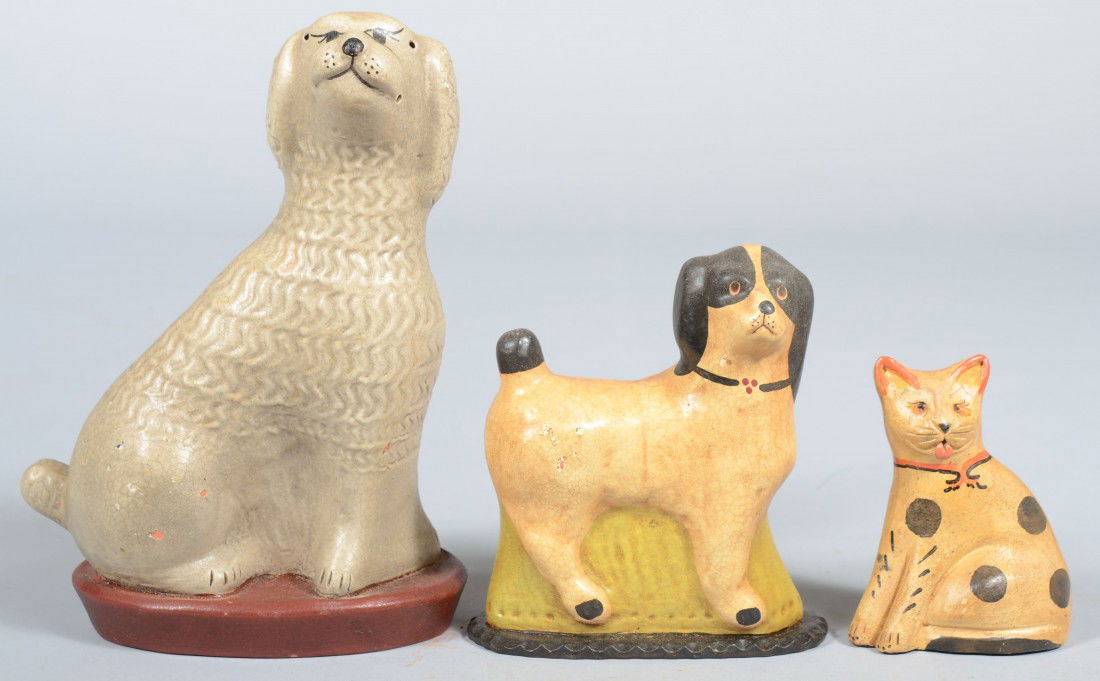 Three Piece Hollow Cast Redware Animal Group. Pood: Three Piece Hollow Cast Redware Animal Group. Poodle: 7 3/4"h.; Standing Dog: 5"h. and a solid Seated Cat: 3 3/4"h. Dogs marked with a seated stag for Springfield Pottery on bottom. Cat not marked. Co