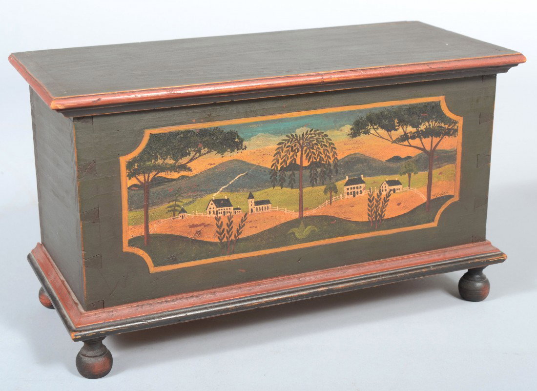 Contemporary Crafted and Painted Miniature Blanket: Contemporary Crafted and Painted Miniature Blanket Chest. Dark green ground, red and black accents, black turned ball feet and a folk art farm scene on front. Unsigned. 7 5/8"h. X 13"w. X 5 7/8"d. Con