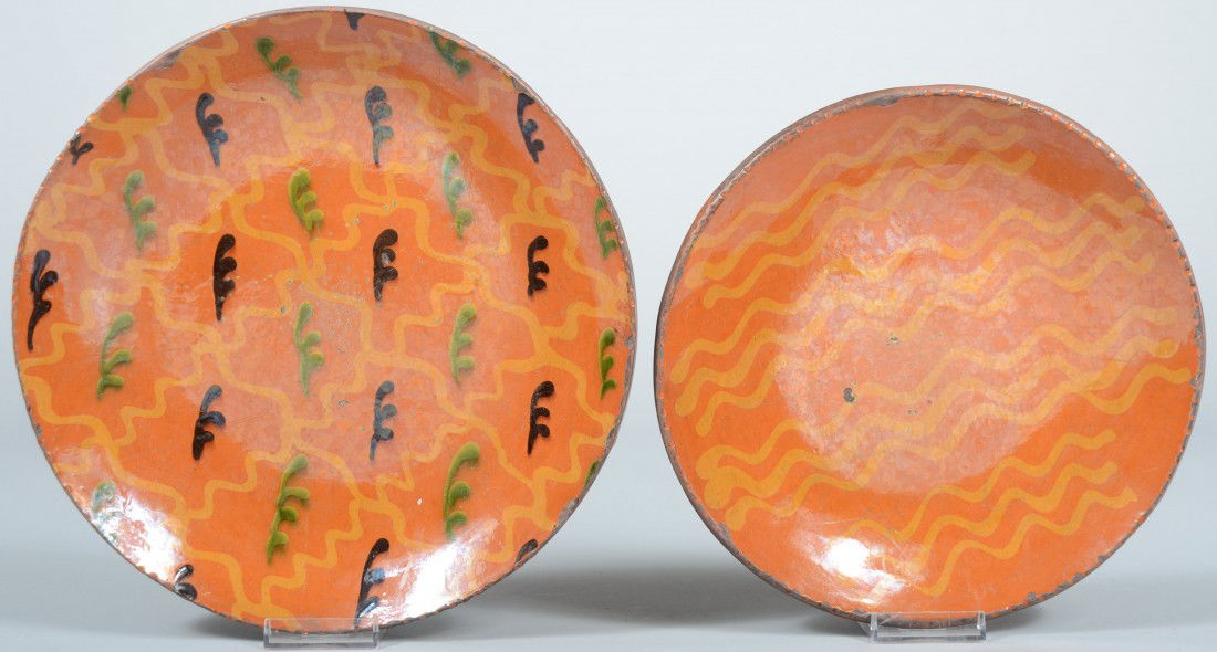 Two Greg Shooner signed, Slip Decorated Redware Pl: Two Greg Shooner signed, Slip Decorated Redware Plates. Larger with yellow, green and black decoration: 10 3/4"dia. and smaller with wavy yellow line slip: 9 1/2"dia. Both signed: "Greg Shooner, 2002.