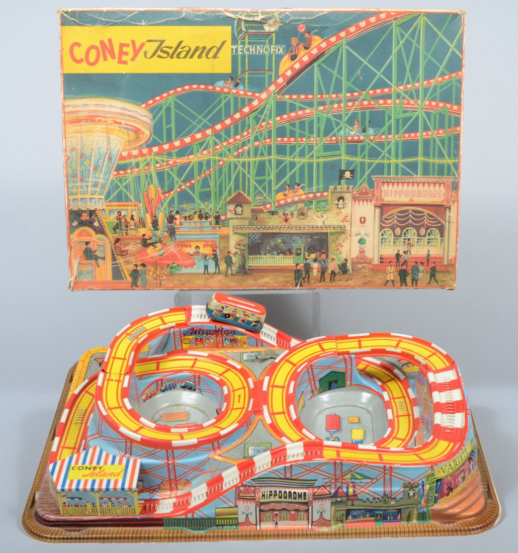 Coney Island Wind-Up Toy in Original Box, screen p: Coney Island Wind-Up Toy in Original Box, screen printed, press molded plastic with lithographed steel tram and track pieces, marked: "Technofix, Mdl. 307" made in Germany. 4"h. X 21"l. X 15"w. Condit