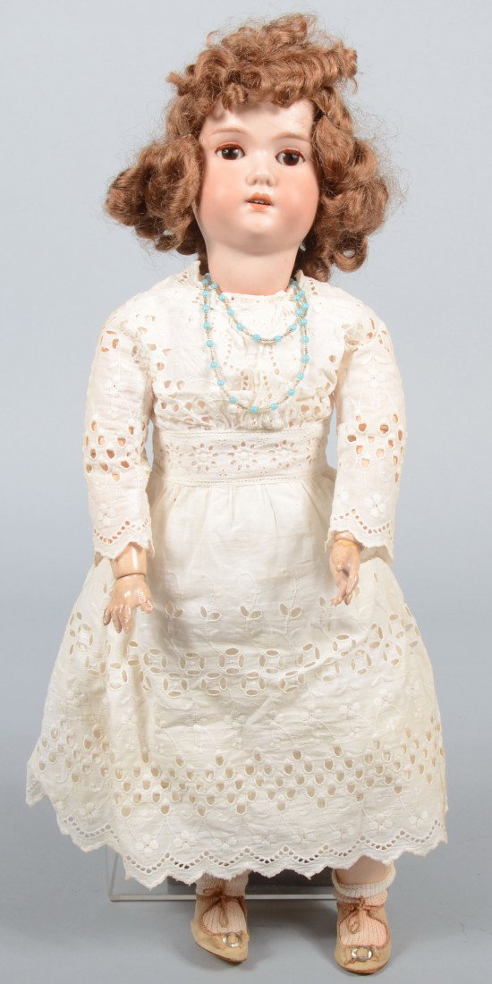 Bisque Head Doll marked: C M BERGMANN II, Made in : Bisque Head Doll marked: C M BERGMANN II, Made in Germany. Auburn hair(loose) and eye lashes on brown glass 'sleep' eyes, open mouth, composition body and jointed limbs. 24"l. Condition: Good.
