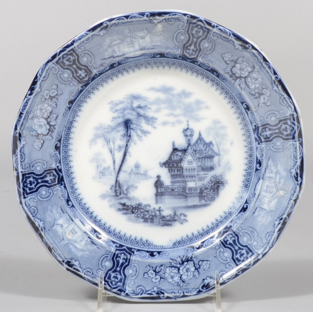 Blue Ironstone Plate, pagoda houses on water, hous: Blue Ironstone Plate, pagoda houses on water, houses and flowers on border, 12 sided rim. Marked: "Tillenberg, Clementson, with spread eagle. 9 1/4" dia. Condition: Good