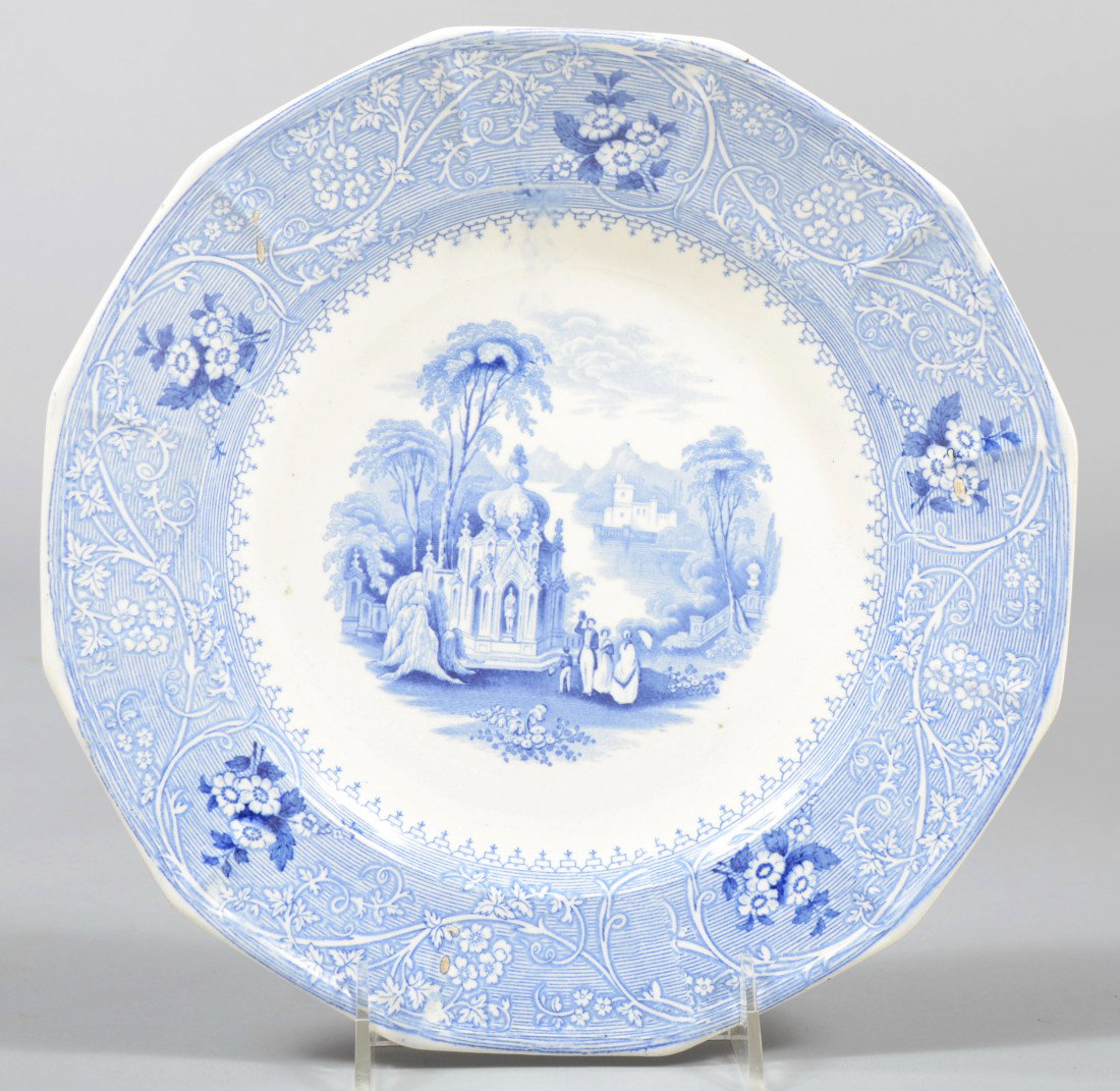 Blue Staffordshire Ironstone Plate, shrine in gard: Blue Staffordshire Ironstone Plate, shrine in garden with touring group and floral border and 12 sided rim. Marked: "Columbia, W. Adams & Sons" verso. 9 3/4" dia. Condition: Good