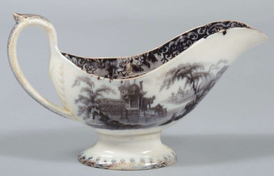 Black Transfer Ironstone Sauce Boat, molded handle: Black Transfer Ironstone Sauce Boat, molded handle with shell mount, pedestal foot. Marked: "Corea, J. Clementson" on base. 8 3/4"l. Condition: Good