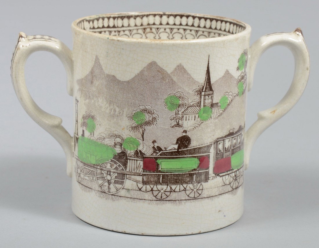 Staffordshire Loving Cup with John Bull Engine Tra: Staffordshire Loving Cup with John Bull Engine Transfer, brown transfer with green and red accents, applied loop handles. Unmarked. 4 1/4"h. X 4" dia. Condition: Good