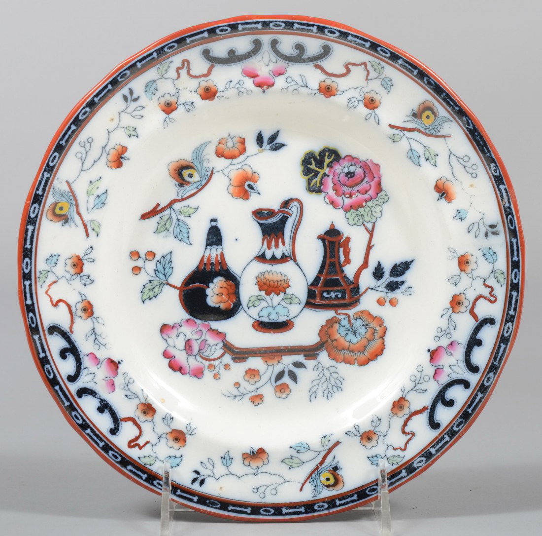 German Chinoiserie Decorated Plate, orange and red: German Chinoiserie Decorated Plate, orange and red over glaze painted blue transfer of urns with floral designs and floral border with red rim. Marked on back: "P. Regout, Maastricht, POMPEIA" 8 1/2"d