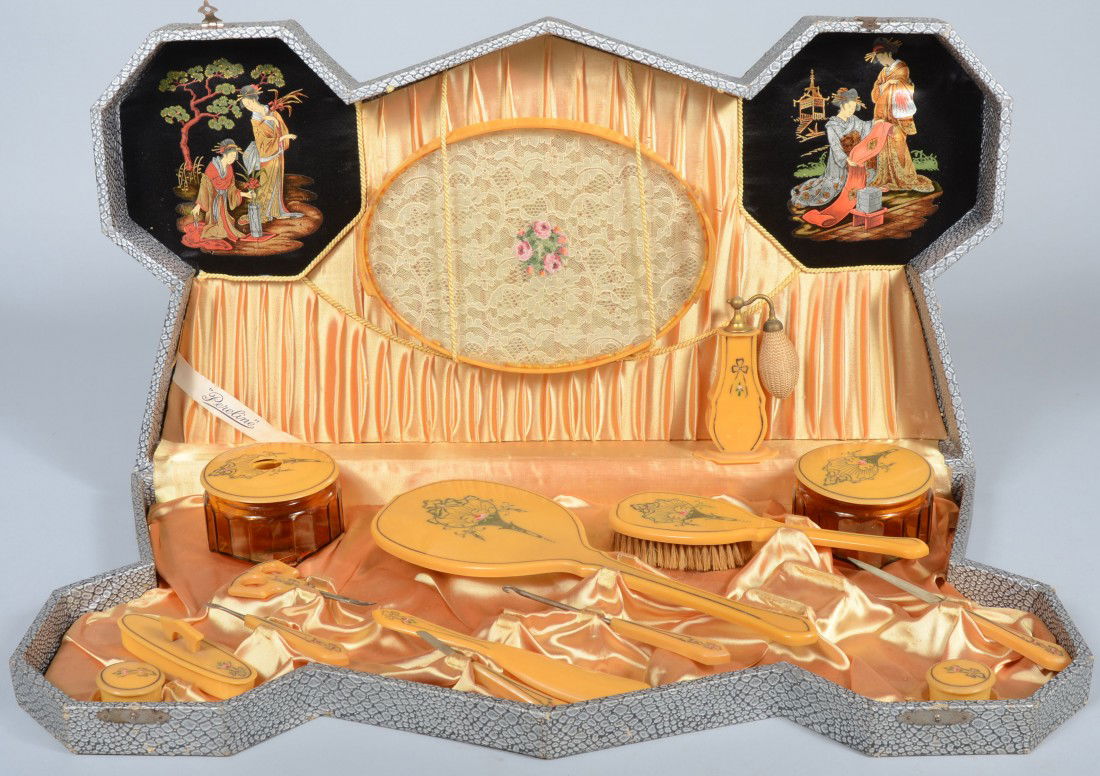 "Pereline" Cased Fifteen Piece Cellulose Vanity Se: "Pereline" Cased Fifteen Piece Cellulose Vanity Set. Japanese needlepoint plaques accent a golden pleated satin lined white faux snakeskin covered case with fitted implements, including hand mirror, b