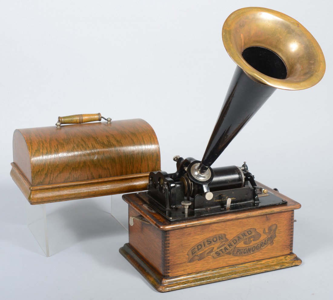 Edison Standard Cylinder Phonograph, in oak carryi: Edison Standard Cylinder Phonograph, in oak carrying case with speaker horn. Newest patent date, 1903. 10 1/2"h. X 12 3/4"w. Condition: Appears complete. Not guaranteed to function.