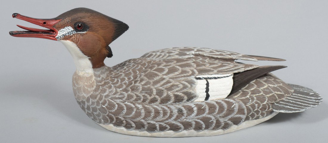 Robert D. Staller signed and stamped Realistic Woo: Robert D. Staller signed and stamped Realistic Wood Carved and Painted Floating Common Merganser Hen. 16 1/2"l. Condition: Good.