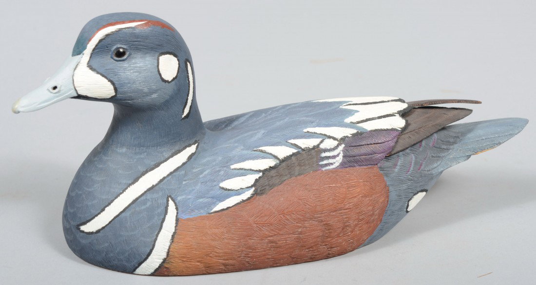 Robert D. Staller signed, Realistic Carved and Pai: Robert D. Staller signed, Realistic Carved and Painted Floating Harlequin Duck. Legend, signature and wood burned stamp all on bottom. Dated "Xmas '87". 12 1/2"l. Condition: small repair to feather on
