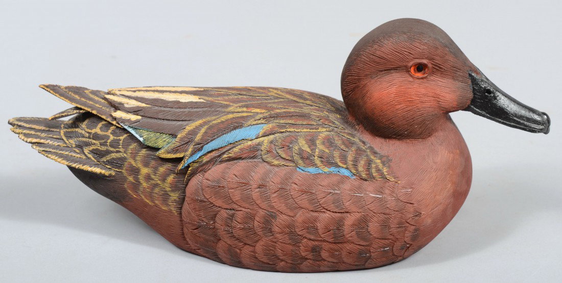 Robert D. Staller signed, Realistic Carved and Pai: Robert D. Staller signed, Realistic Carved and Painted Floating Cinnamon Teal. Legend, wood burned brand, signature and date, 1990, all on bottom. 11 1/2"l. Condition: Good.