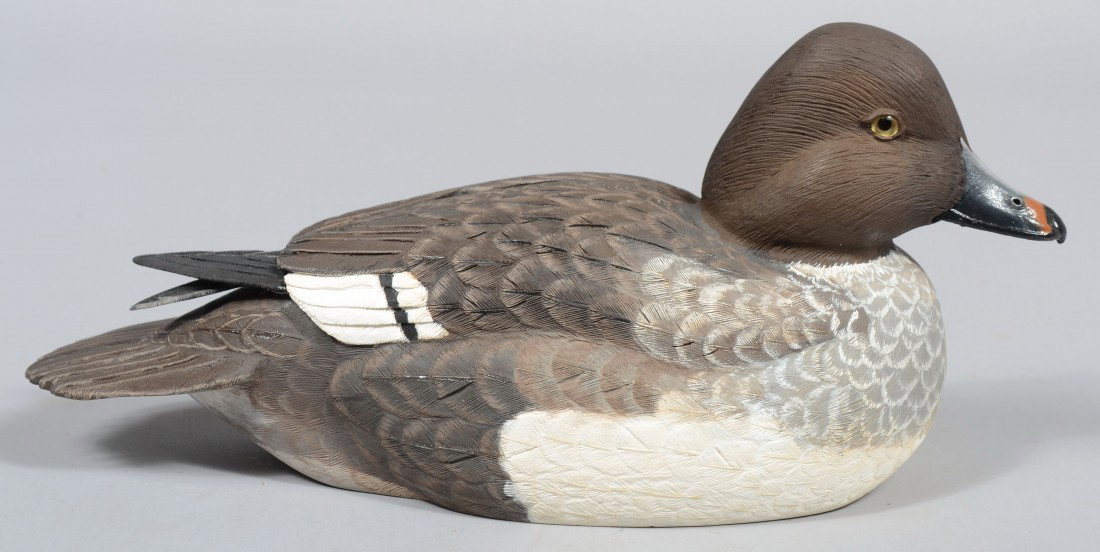 Robert D. Staller signed, Realistic Carved and Pai: Robert D. Staller signed, Realistic Carved and Painted Barrow's Goldeneye Hen. Signed, branded and dated, 1992, on bottom. 13 1/2"l. Condition: Good.