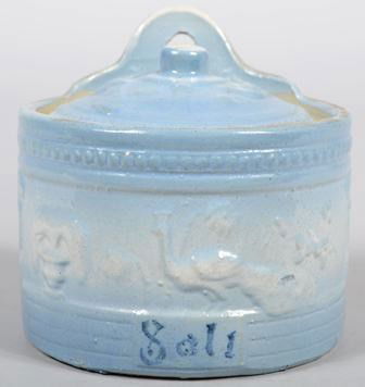 Stoneware Hanging Salt Box with light blue colorat: Stoneware Hanging Salt Box with light blue coloration and cobalt lettering. Featuring bas-relief decoration around middle and on lid. 5 7/8"h. X 6"dia. Condition: Chip off under lid.