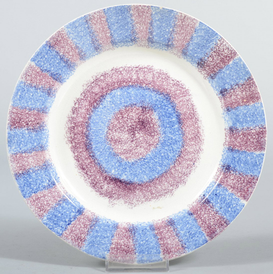 Purple and Blue Rainbow Spatter Ironstone China 8 : Purple and Blue Rainbow Spatter Ironstone China 8 1/4" Plate with central bull's eye design. Condition: good with tiny edge chip.