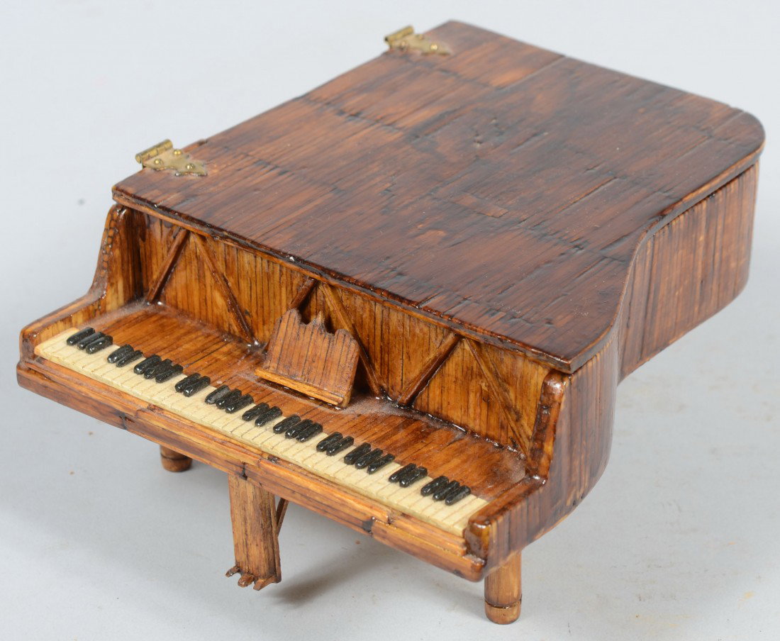 Tramp Art Match Stick Grand Piano Vanity Box. Faux: Tramp Art Match Stick Grand Piano Vanity Box. Faux fur lined interior with a mirror fragment on lid. Heavily varnished case with black and white painted keyboard and brass hinges. 3 3/4"h. X 6 3/8"w. 