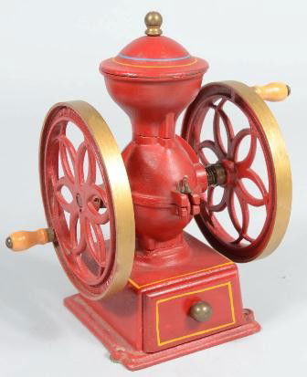 Red Painted Double Wheeled Cast Iron Counter Top: Red Painted Double Wheeled Cast Iron Counter Top Coffee Mill. Two wood handles, blue, yellow and gold accents and includes original receiver drawer. Wheel marked: "John Wright Inc., Wrightsville, PA.