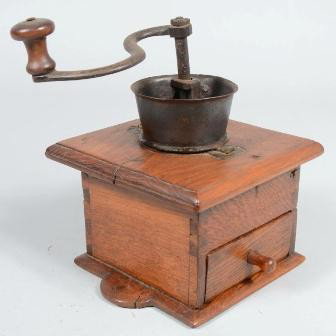 Square Wood Coffee Mill. Mixed woods case has dem: Square Wood Coffee Mill. Mixed woods case has demilune and beveled edge to base; receiver drawer; molded top board ; wrought iron hopper, crank and mechanism. Unmarked. 10 1/2"h. X 8" X 8". Condition: