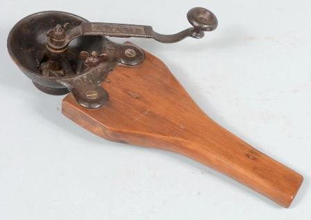 Hand Held Wooden Handled Cast Iron Coffee Grinder: Hand Held Wooden Handled Cast Iron Coffee Grinder. Crank handle marked: "Adams" and body flange marked: "Patent" with 1840 on underside of hopper. 14 1/2l. X 3 3/4"h. X 5"w. Condition: Good.