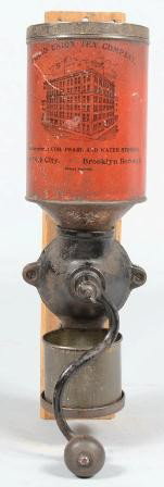 Grand Union Tea Company Coffee Mill. Red sheet me: Grand Union Tea Company Coffee Mill. Red sheet metal canister with black lithographic illustration and text secured to a black painted cast iron grinder with 'S' crank and wood knob. All mounted on a 