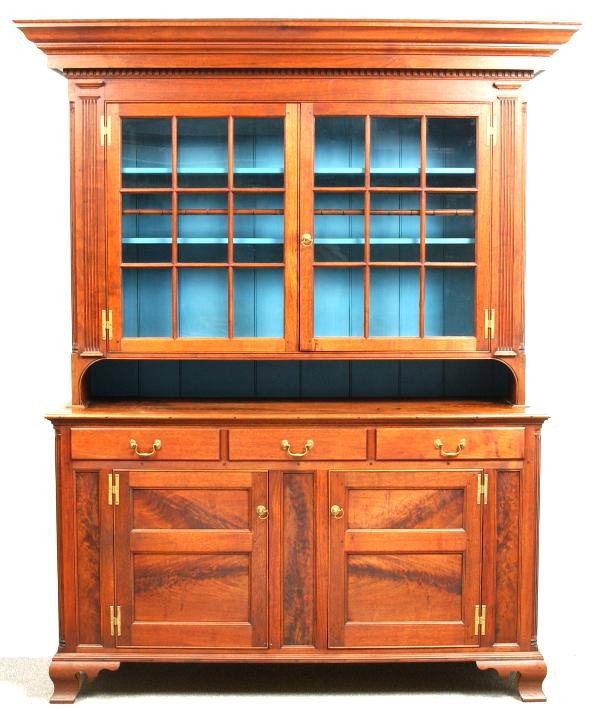 Contemporary Pennsylvania Walnut Dutch Cupboard. : Contemporary Pennsylvania Walnut Dutch Cupboard. Multi-layered cornice with dental molding above a eighteen light, double door upper cupboard with brass 'H' hinges and pull, flat fluting with moldings