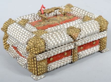 Ornate Chip Carved Trinket Box. Painted gold and : Ornate Chip Carved Trinket Box. Painted gold and silver with red velvet lined panels with a putti decorated cast brass handle and painted tacks. Box features a carved 'hidden' key cover and retains th