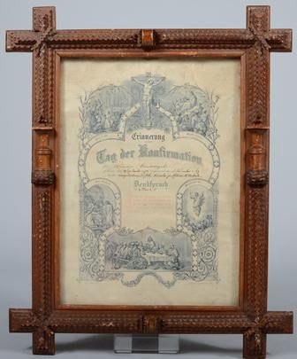 Tramp Art Type Picture Frame with Printed Church : Tramp Art Type Picture Frame with Printed Church Confirmation, dated 1875. Crossed corner style frame, chip carved decoration with applied thread spool halves. 21 1/8"h. X 17"w. Condition: Some bumps 