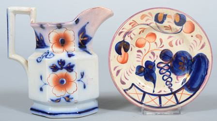 Two Pieces of Gaudy Decorated China; 1st is a Gau: Two Pieces of Gaudy Decorated China; 1st is a Gaudy ironstone floral pattern paneled cream pitcher, 5 3/4" high, (two chips) and the second is a Gaudy Welsh tar baby 5 1/2" toddy plate, (good).