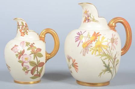 Two Royal Worcester Cream Pitchers with floral an: Two Royal Worcester Cream Pitchers with floral and gilt decoration, 5 1/2" and 7" high. Condition: good.