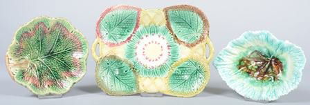 Three Various Pieces of Majolica Pottery; 11" flo: Three Various Pieces of Majolica Pottery; 11" floral and leaf rectangular tray with open handles and two leaf form small bowls, 7" and 7 3/4". Condition: good.