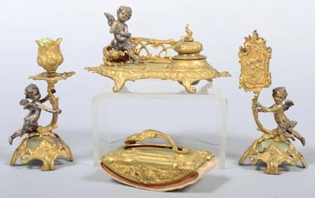 Four Piece Gilded Brass Ladies Desk Set, with sil: Four Piece Gilded Brass Ladies Desk Set, with silver plated cherubs and marble inserts, no makers marks; inwell: 3 1/4"h. X 6 1/4"w.; candlestick: 5"h.; match box holder: 5 1/2"h.; demi-lune ink blott