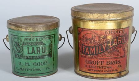 Two Covered Lard Tins with Bail Handles. "H.H. Go: Two Covered Lard Tins with Bail Handles. "H.H. Good, Elizabethtown, PA.", 5 1/4"h. and "Groff Bros., Elizabethtown, PA.", 6 1/4"h. Condition: Both Good, with use wear.