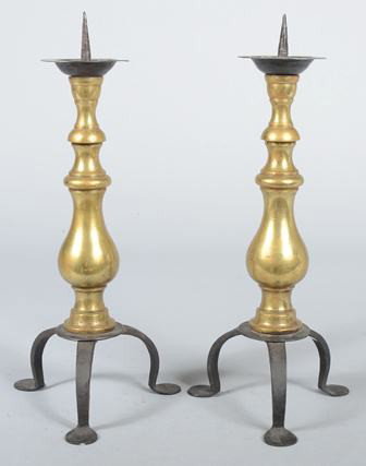 Pair of Brass Balister Candle stands. Hand forged: Pair of Brass Balister Candle stands. Hand forged iron legs, feet, bobesch and spike. Leg marked with a 'T'. 15 3/4"h. Condition: Good.