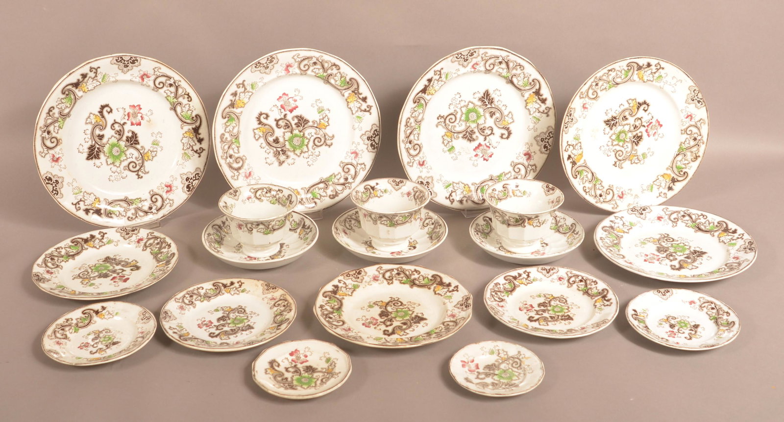 Brown Transfer Ironstone China Aurora Pattern.: Brown Transfer Ironstone China Aurora Pattern. 13 Plates, 4" to 9" diam.; 3 Cups and Saucers. Condition: Very good.