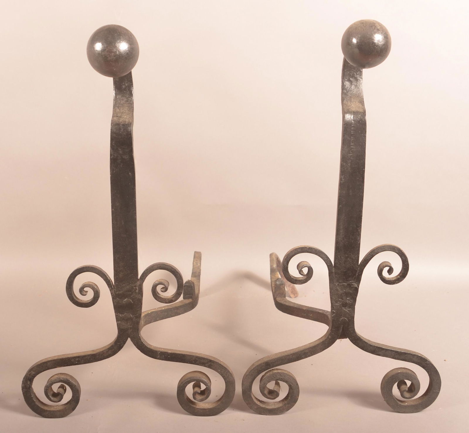Pair of Period Style Wrought Iron Andirons.: Pair of Period Style Wrought Iron Andirons. Signed. Scroll and cannon ball design. 25"h. Condition: Good.