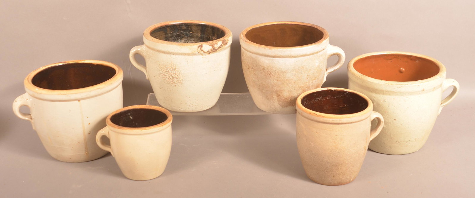 Six Antique Salt Glazed Apple Butter Crocks.: Six Antique Salt Glazed Apple Butter Crocks. 5"h. to 7-1/2"h. Condition: Good with wear.